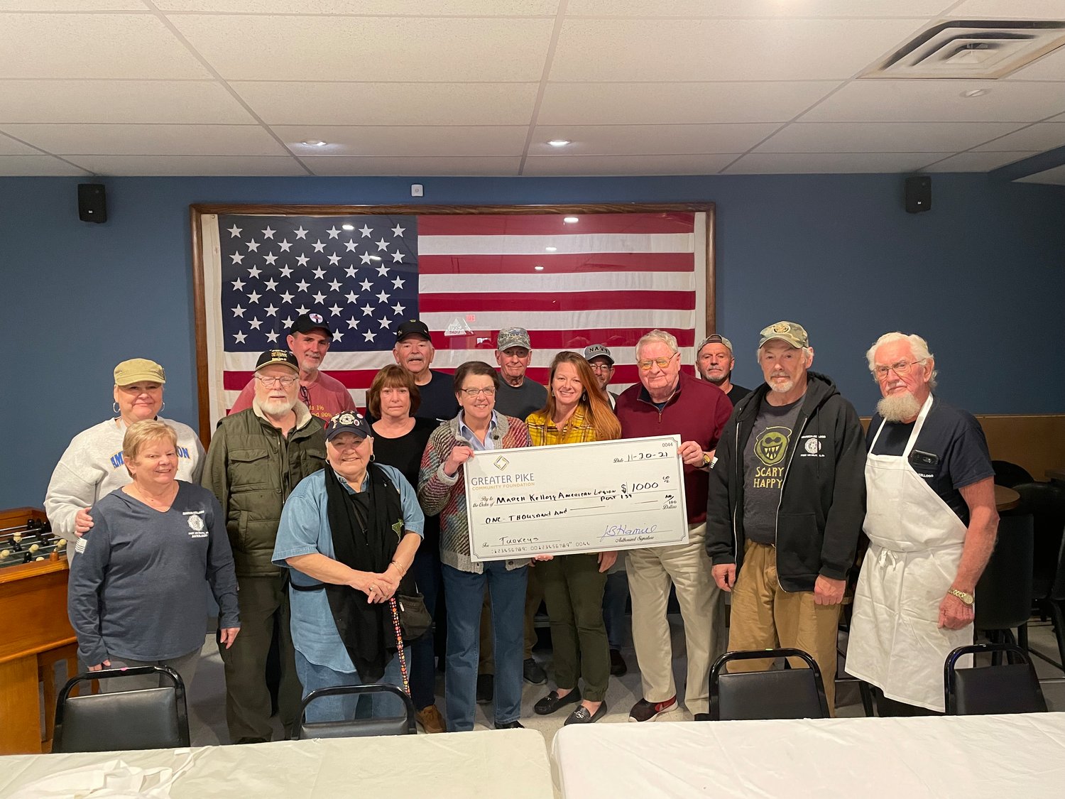 Cornelia (Connie) Harvey, Commander of American Legion Post 139, center, receives $1,000 from Greater Pike Community Foundation to purchase turkeys for the Legion’s holiday event. Foundation Board member Maryann Monte and Board Chair Jim Pedranti, presented the grant.